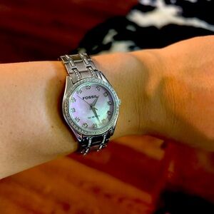 Pink mother of pearl Fossil blue watch.